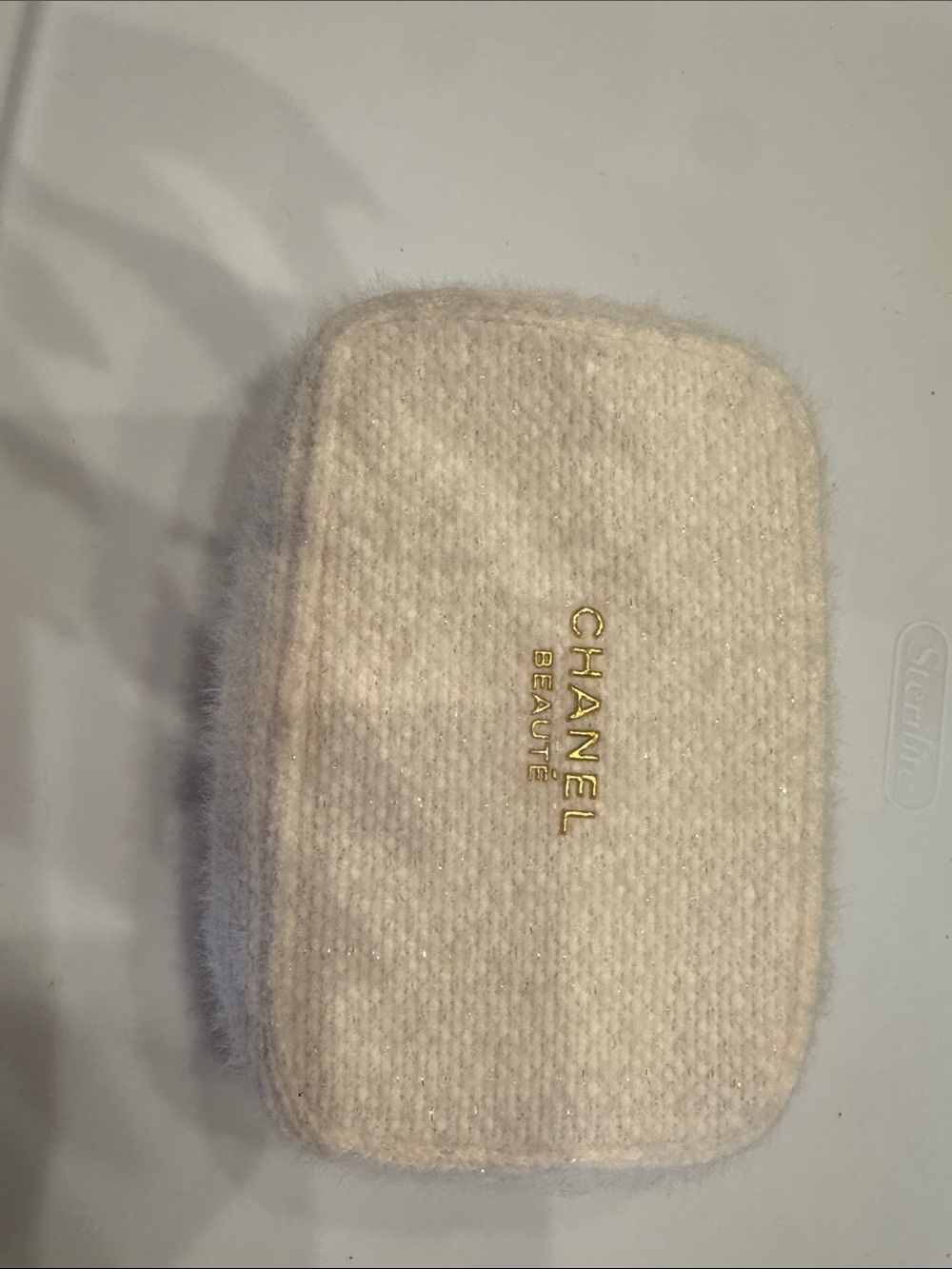 CHANEL Cream Knit Phone Case with Gold Logo